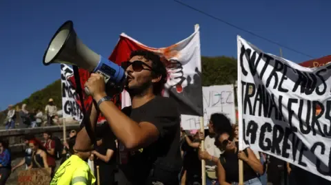 France-Wide Strikes Erupt In Response to Spending Cuts